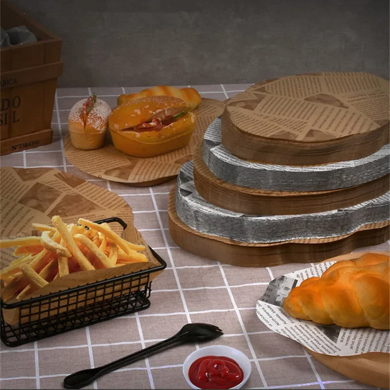 

100Pcs Oval Lace Pad English Newspaper Printed Greaseproof Paper Oil Absorbent Hamburger Bread Baking Tray