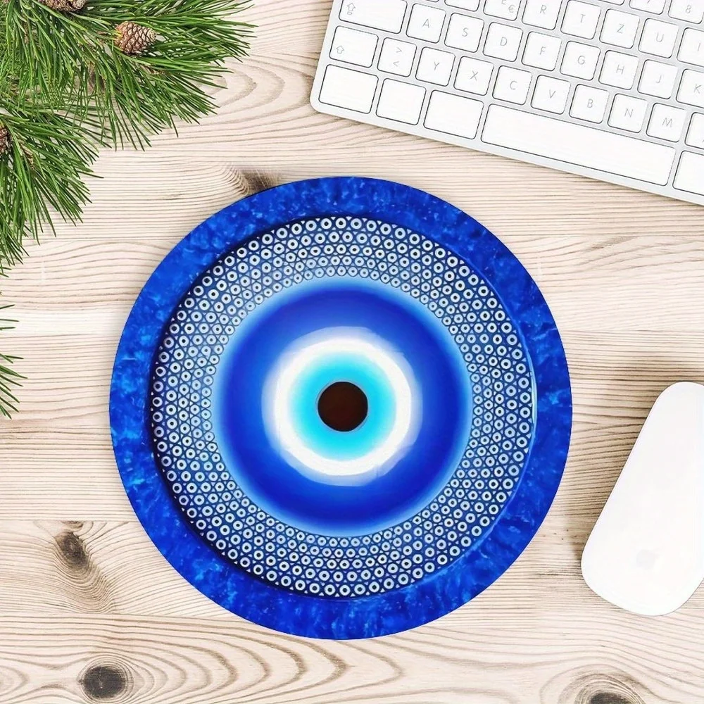 The blue evil eye circular mouse pad with a textured anti-slip rubber base is waterproof and suitable for gamers and office use