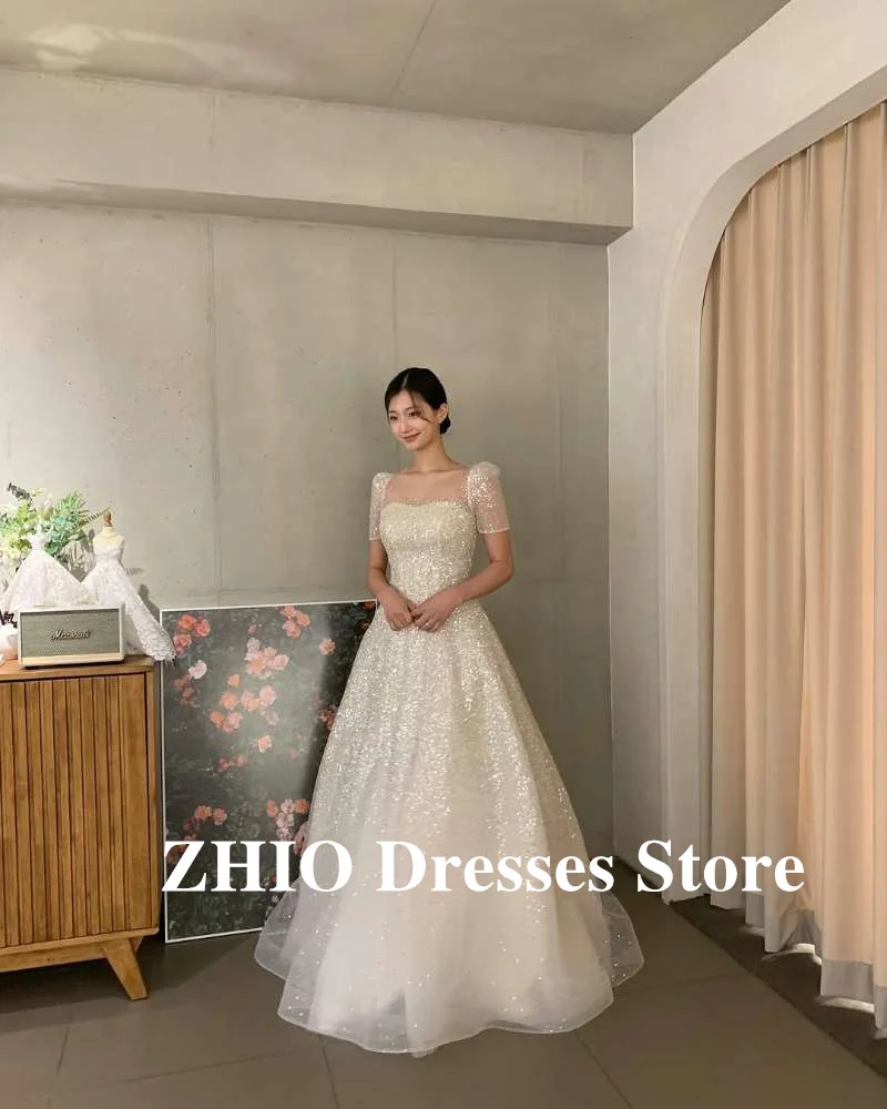 ZHIO فساتين زفاف لامعة لامعة كوريا صورة تبادل لاطلاق النار قصيرة الأكمام ساحة الرقبة تول فساتين العروس مساء لامعة حسب الطلب