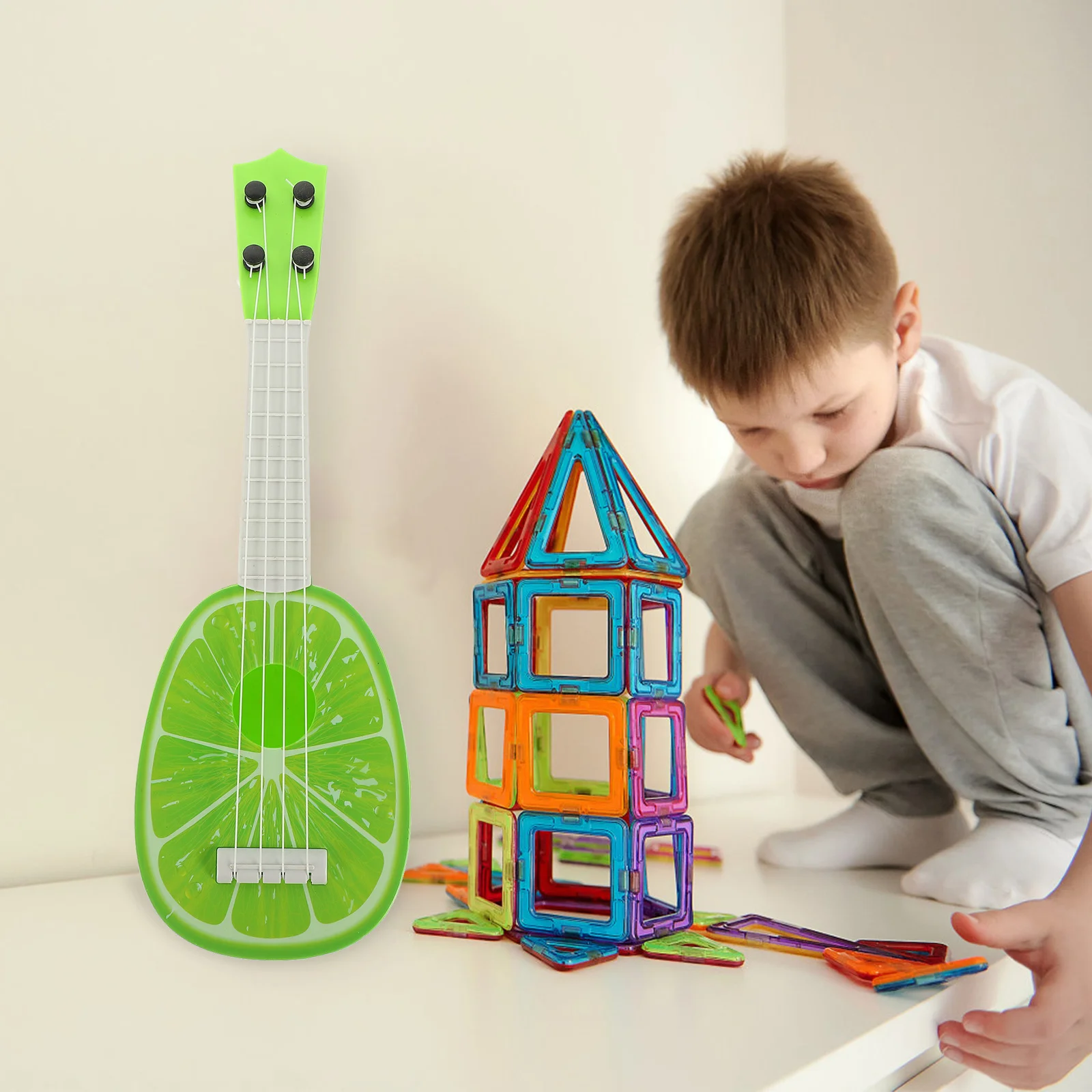 جيتار أطفال بلاستيكي صغير القيثارة ألوان زاهية أداة تعليمية لإدراك الموسيقى تطوير اللعب
