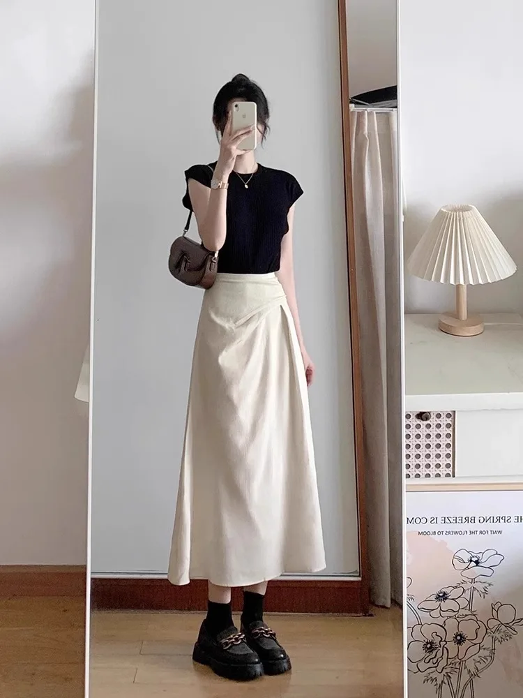 Aprikosenfarbener High-Waist A-Linien-Midirock für Damen, Sommer 2026, dünner, unregelmäßiger, hüftbedeckender Schirmrock, modischer Pack-Hip-Stil – Detail 9
