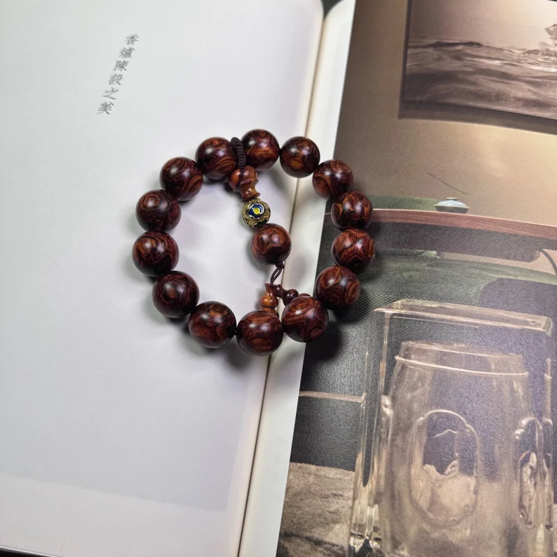 

Authentic Hainan Huanghuali 1.6cm Buddhist beads with oil pear and ghost face design