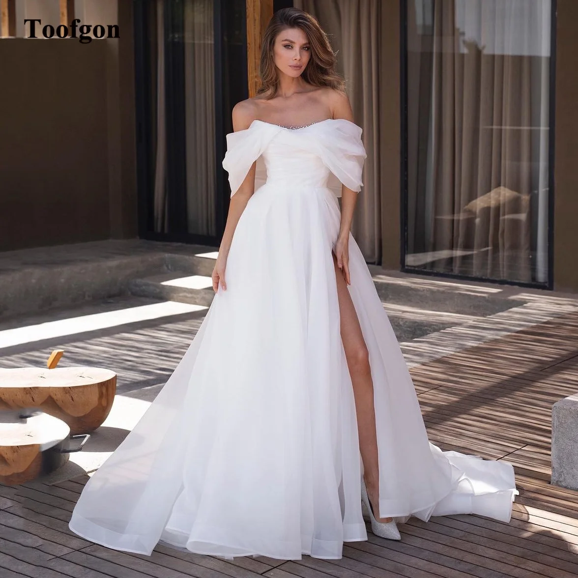 

Toofgon Beach Organza Wedding Dresses Off The Shoulder Nude Scoop Bead Bridal Gowns Split Women Formal Party Wedding Bride Dress