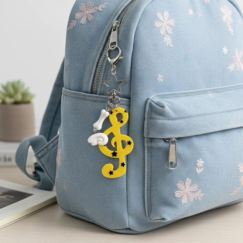 Niedliche Acryl-Musiknoten-Schlüsselanhänger mit hübscher Flügelverzierung in verschiedenen Farben, Taschenanhänger, Geschenke für Musikliebhaber. – Detail 6