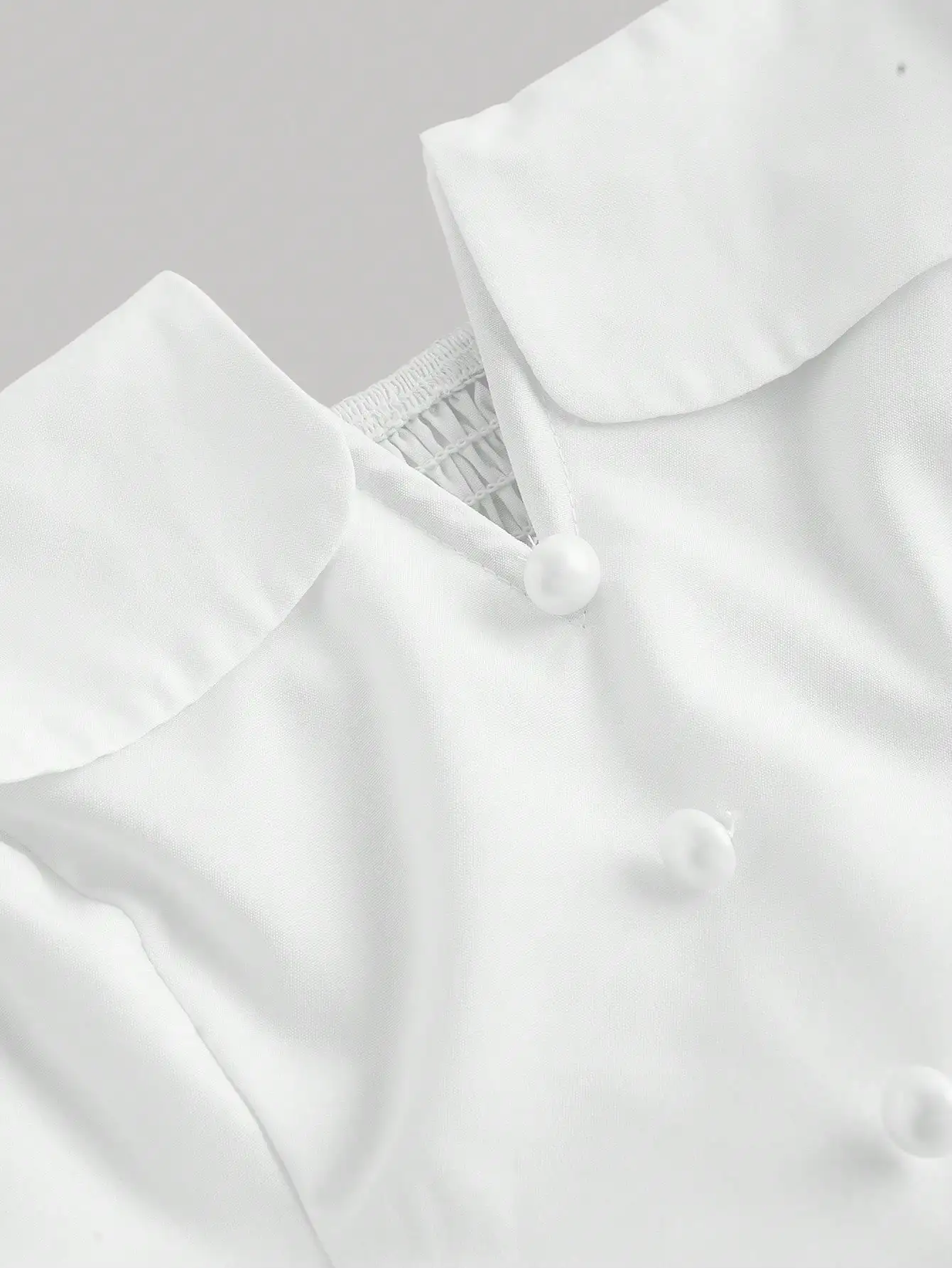 

Women White V-Neck Sleeveless Waisted Dress With Pearl Buttons