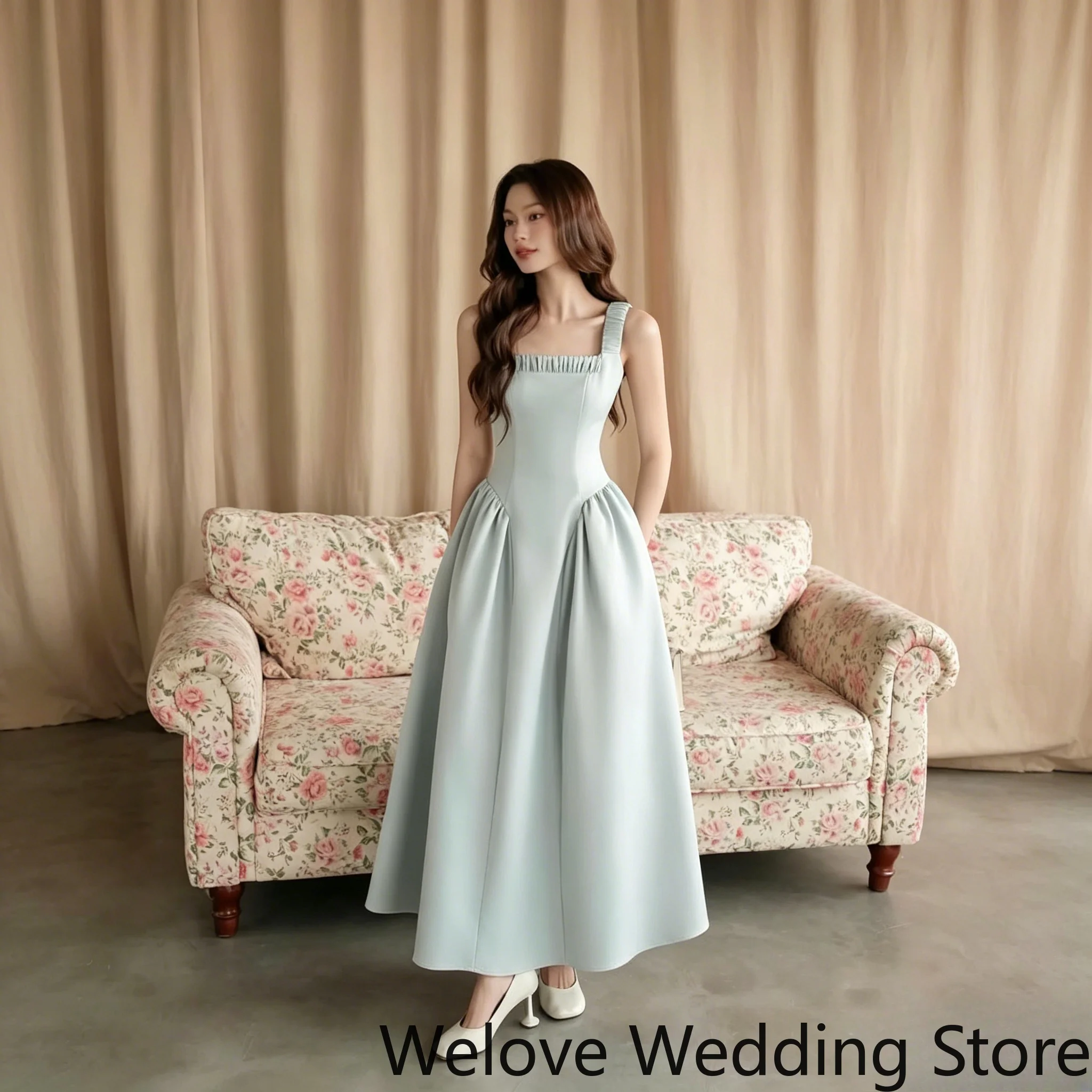 

Light Blue Elegant Formal Midi Dress with Square Neckline, Ruffled Strap Detail, Smooth Satin Fabric, Fitted Corset‑Style Bodice