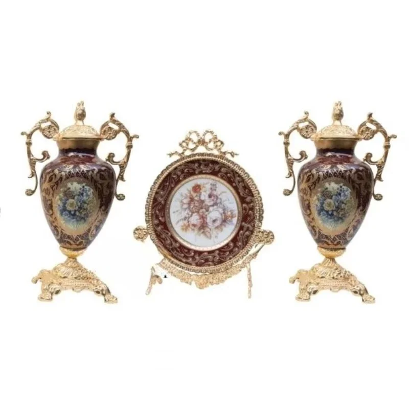 Antique brass and porcelain trim set with floral painted vases and ornate plates with vintage-inspired designs