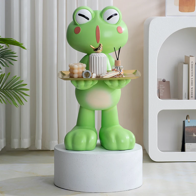 Creative Frog That Only Goes Into The Piggy Bank But Never Leaves It, A Floor Tray Ornament Next To The Simple TV Cabinet