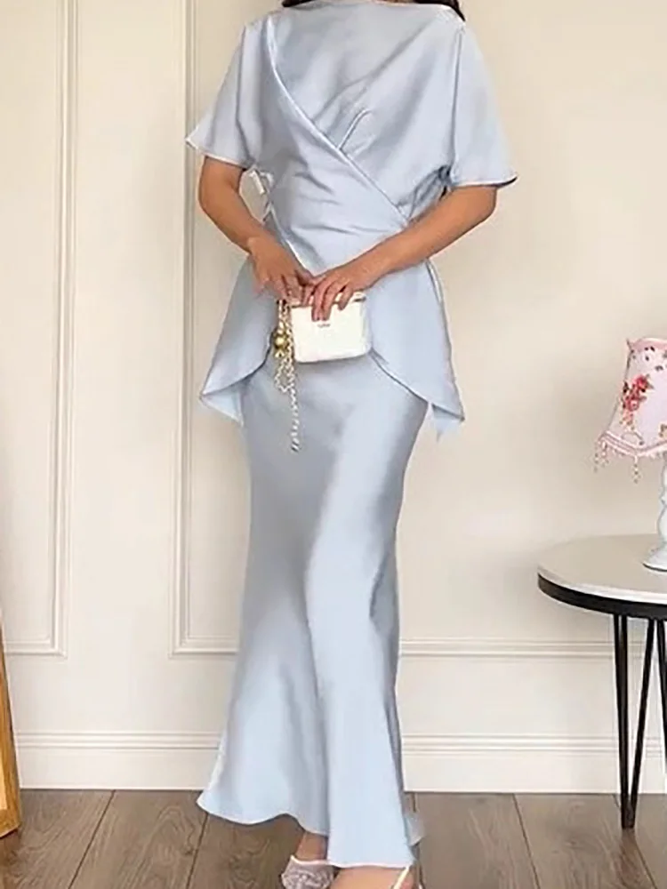 

2025 весна лето однотонный атласный наряд женский сексуальный топ с круглым вырезом нестандартной формы и длинные юбки костюм новый повседневный тонкий офисный комплект с короткими рукавами