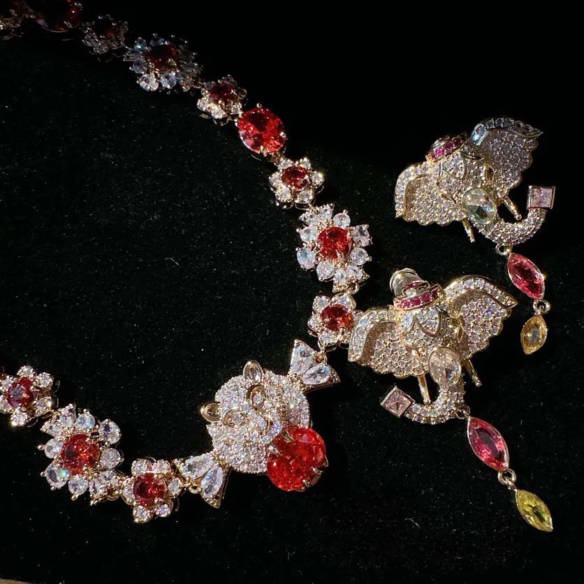 Women Sotheby's cheetah gemstone necklace plated with 18K gold pomegranate red baby elephant zircon earrings