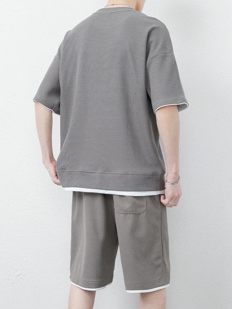 مجموعة ملابس رياضية صيفية للرجال من Ice Silk ort Sve كاجوال فضفاضة تناسب خمسة أرباع سراويل مستقيمة الساق قابلة للتنفس ومريحة...