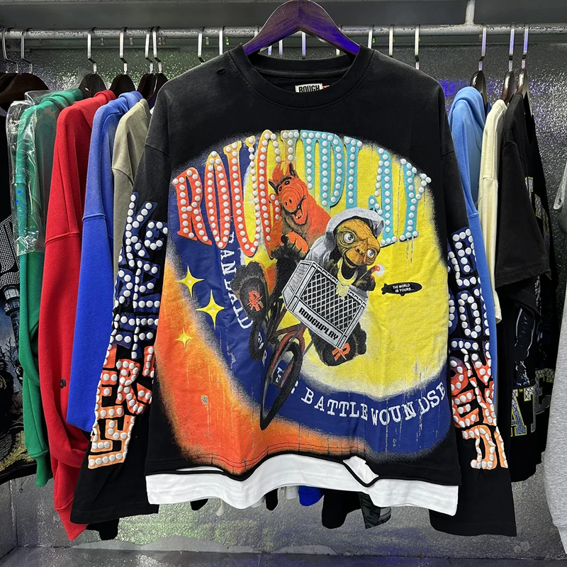 

Тенденции уличной одежды ROUGHPLAY Футболка с длинными рукавами Повседневные топы с логотипом и принтом Подол с рваными дырками Черная грубая игровая футболка