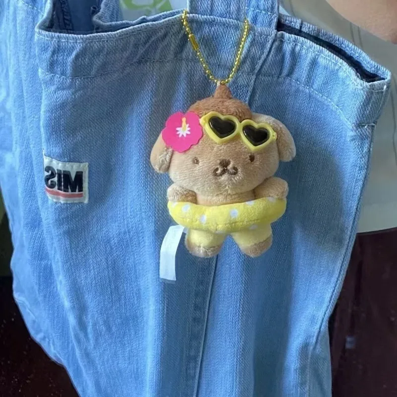 Sanrio Kawaii Hawaii Swim Ring Pompompurin Peluche bambola Ciondolo carino Pelle scura Budino Cane peluche Portachiavi Borse di pezza Borsa Fascino