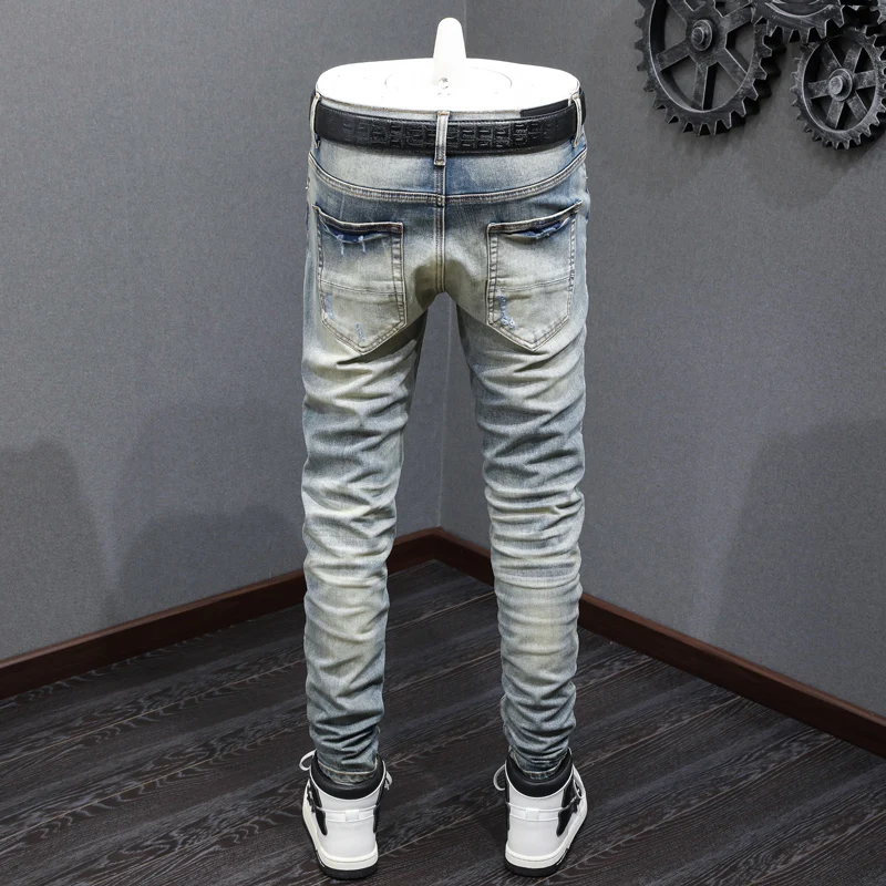 Designer Fashion Men's Slim Fit Jeans Retro Washed Elastic Pleats Perforated Red Skin Patch Light Blue High Waist
