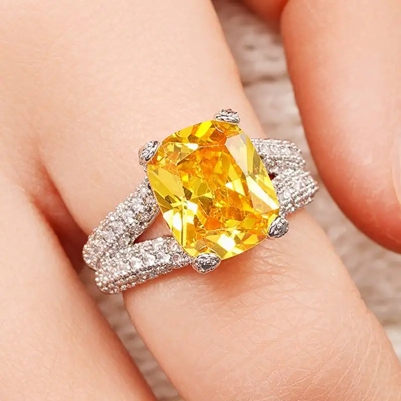Huitan Damen-Ring mit eingelegtem, leuchtend gelbem Zirkonia, luxuriöse Accessoires, trendiger silberfarbener Schmuck für Party, Verlobung, Alltag