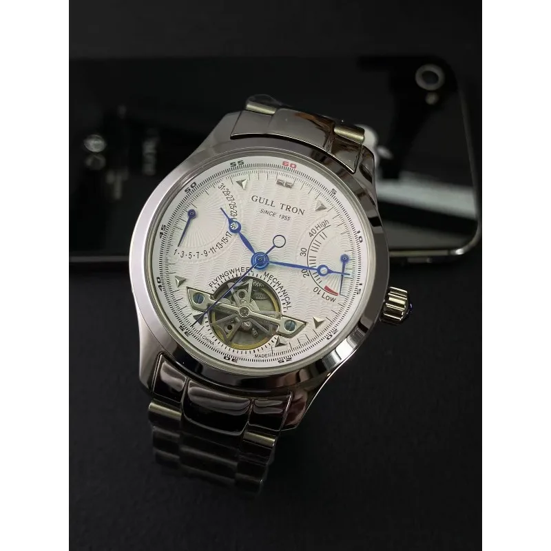 ساعة رجالية ميكانيكية أوتوماتيكية بحزام فولاذي للأعمال متعددة الوظائف وتقويم الاستقرار في الغلاف الجوي وعرض الطاقة الحركية