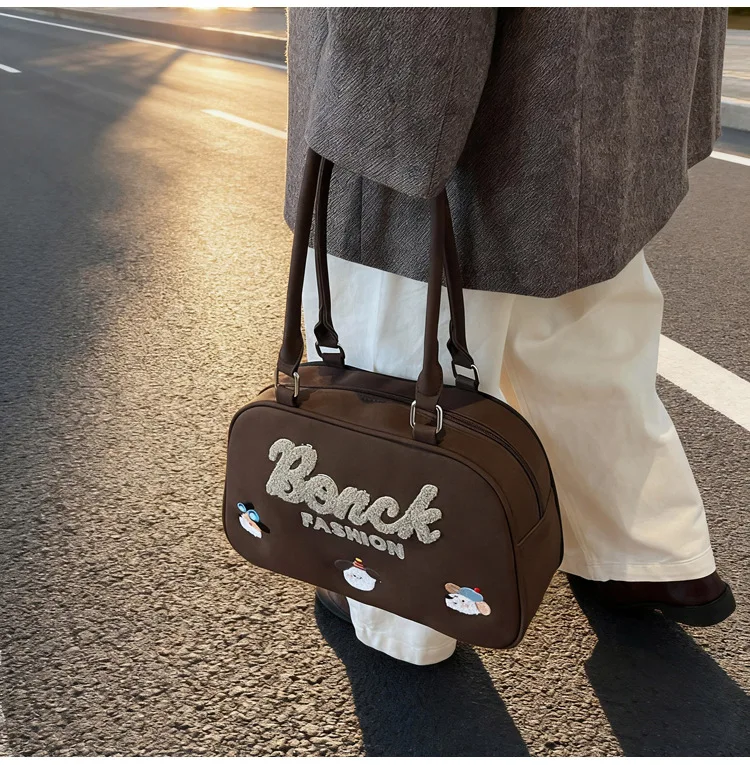 Hot-selling Korean version of cartoon cute embroidered handbag fashionable texture large capacity portable going out women's bag