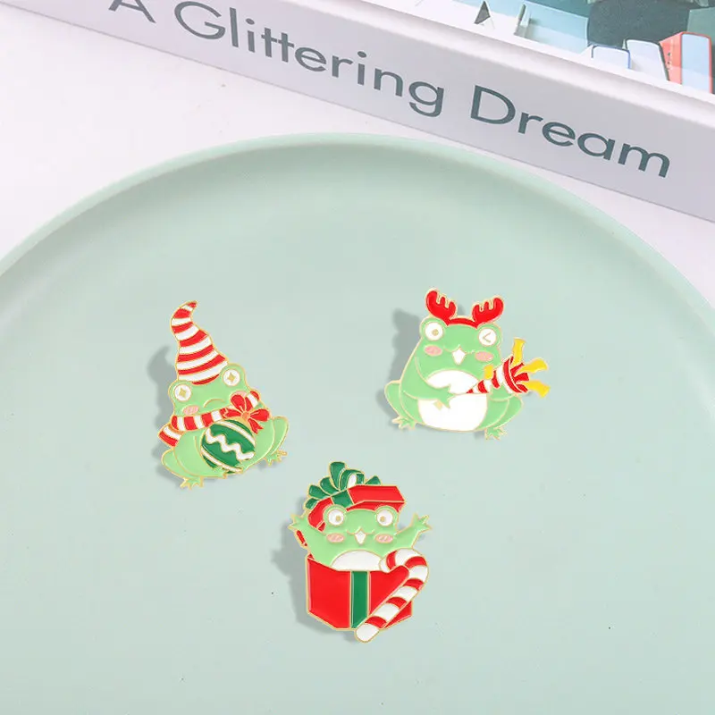 Christmas Frog Enamel Pins Custom Magic Wand Deer Scarf Hat Brooches Bag Badge Childlike Cartoon Jewelry New Year Gift for Kids