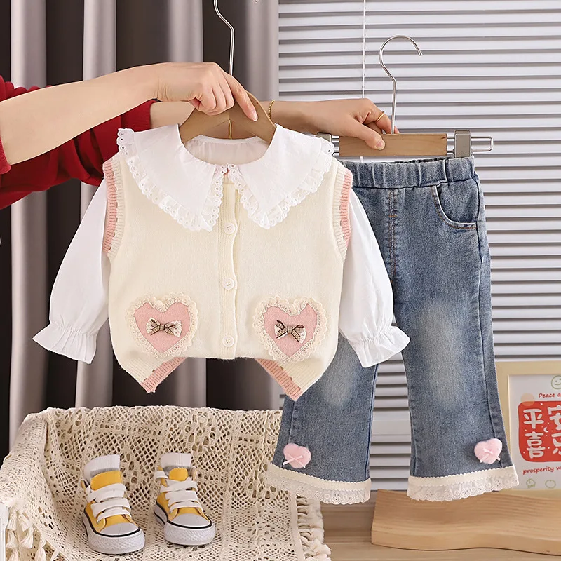 2026 Spring Baby Girl Clothes 3 Piece Set White Lace Ruffle Shirt + Heart Knit Vest + Bow Flare Jeans Kids Cute Princess Outfits