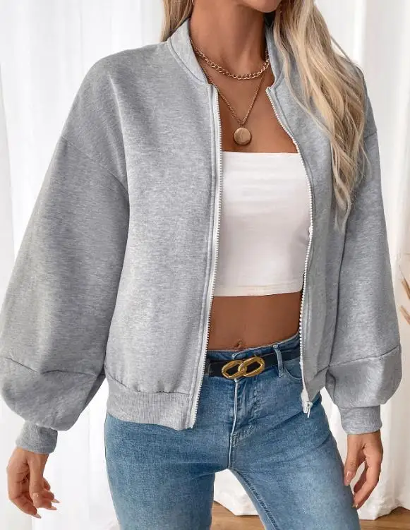 ゆったりとした女性の春の無地ラウンドネックジッパーフロントランタンスリーブベースボールジャケットは、スポーツや運動に適しています。