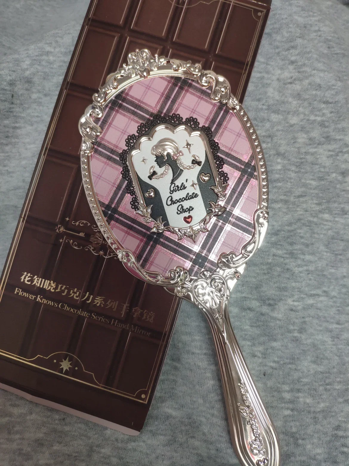 

Цветок знает ручное зеркало вокруг зеркала, зеркала для макияжа, шоколада с единорогом