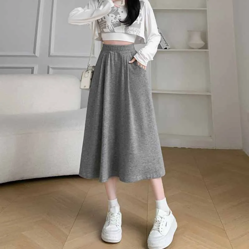 Cor sólida casual com bolsos a linha saias femininas coreano emagrecimento elástico de cintura alta saia longa mulher versátil midi saias