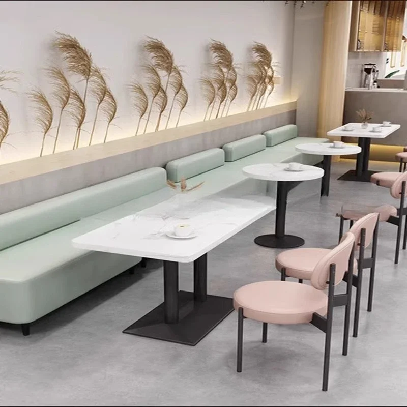 The library lounge area negotiates the commercial use of tables and chairs