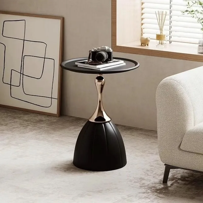 Detail shot of weighted round base of a sidetable on rug