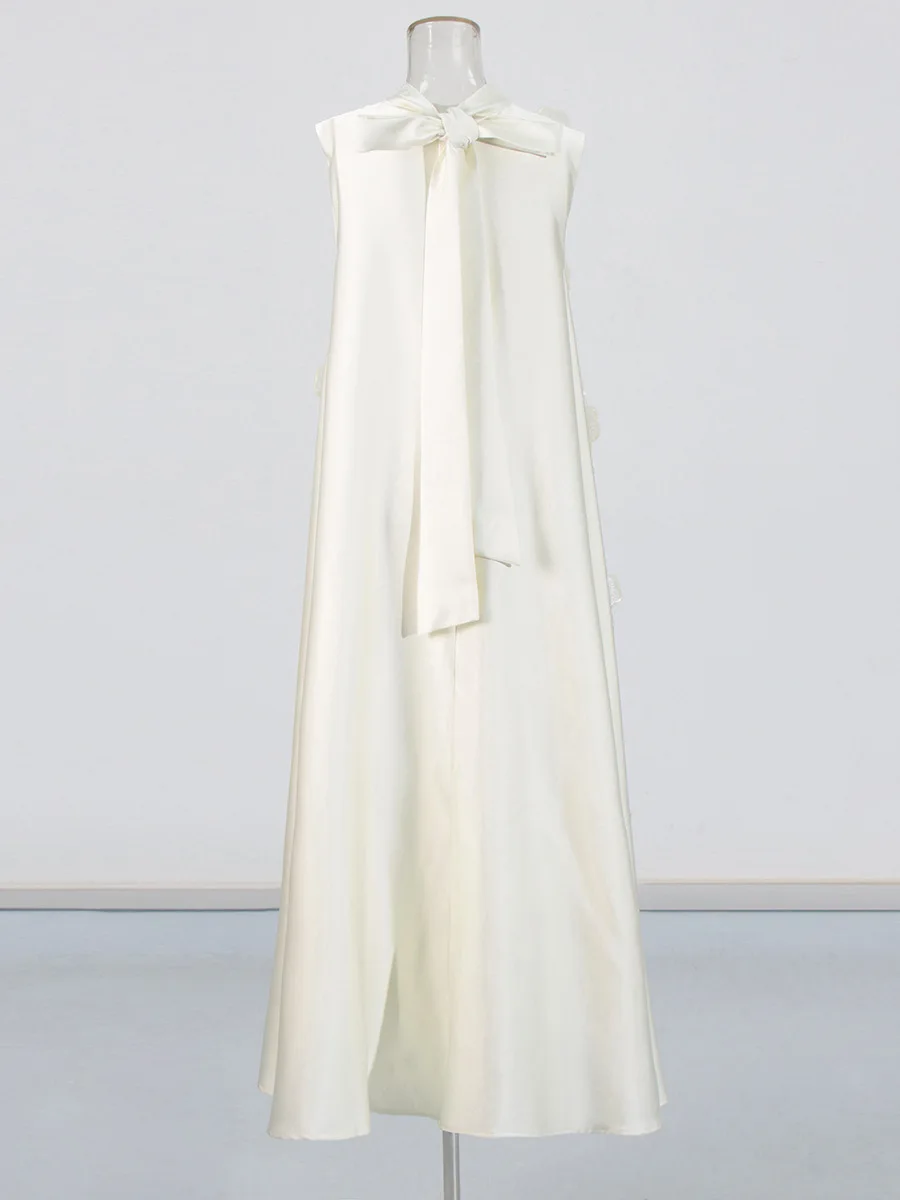 ชุดเดรสยาวลำลองสีชมพู แขนกุด ผูกหลัง ดีไซน์ดอกไม้สามมิติ สไตล์ดาราแฟชั่น ปี 2025