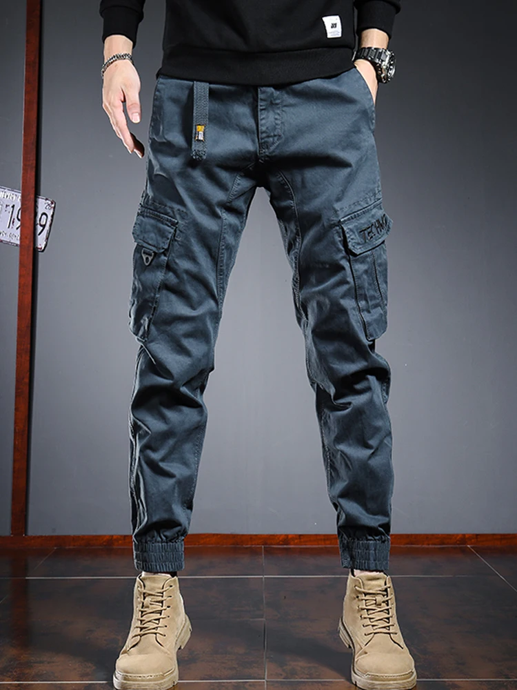 

Рабочие брюки в стиле ретро, ​​американский стиль, новинка 2024 года, мужские износостойкие модные брендовые брюки с несколькими карманами, эластичные свободные брюки с манжетами, длинные брюки для активного отдыха
