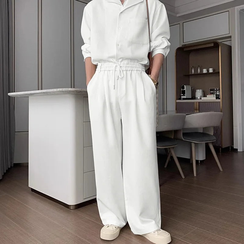 

INCERUN Мужские комплекты Однотонная рубашка с длинными рукавами и брюки с лацканами Комплекты из двух предметов Уличная одежда Свободные 2025 Корейский стиль Повседневные мужские костюмы