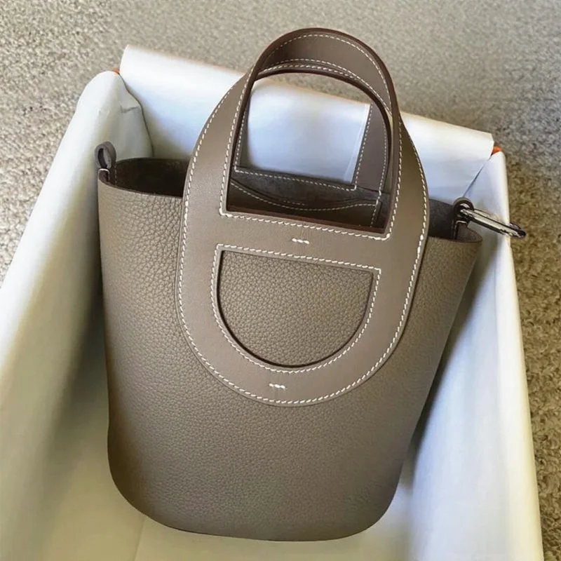 

Cross-border New Women's Bag. Premium Light Luxury Handbag. Top-Grain Cowhide "Basket Bag" / "Pig Nose" Bucket Bag.
