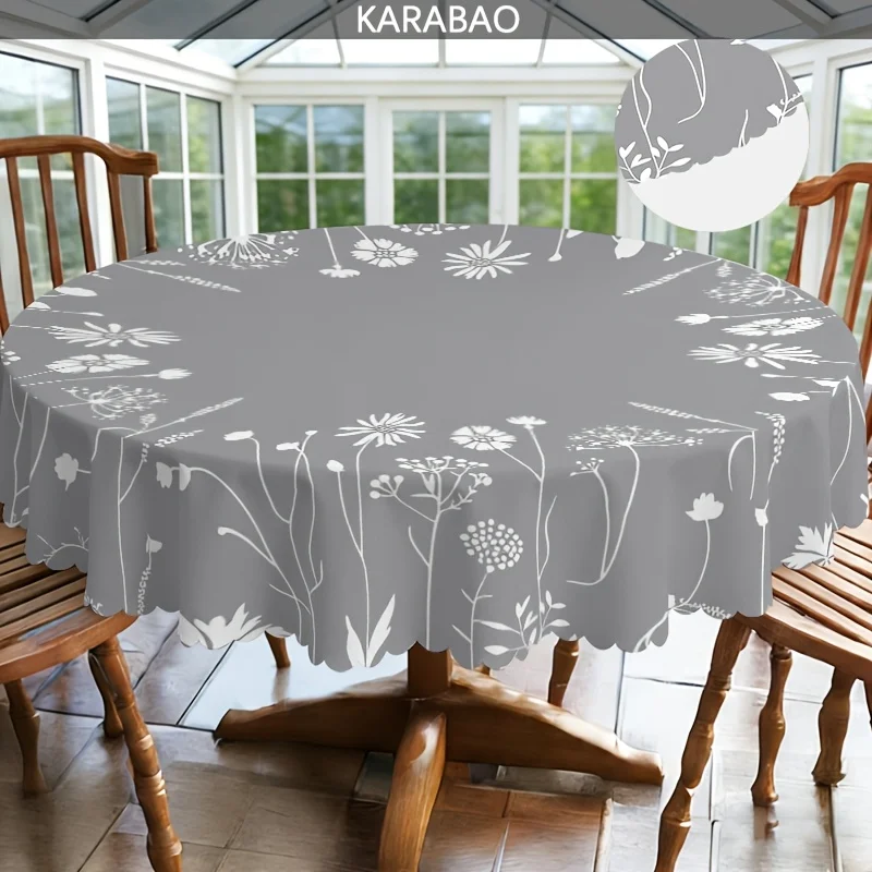 A round tablecloth with a grey background and white floral pattern, featuring an elegant and natural design.