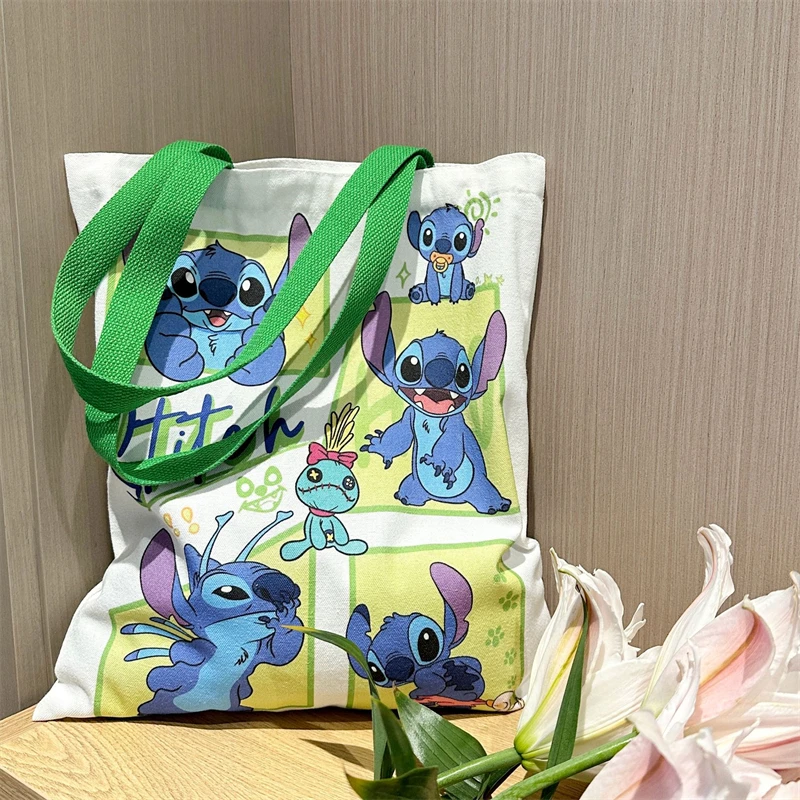 Borsa di tela Disney Stitch Cute Cartoon Angel Fashion borsa per lo Shopping portatile ad alta capacità borsa a tracolla fresca regali di festa