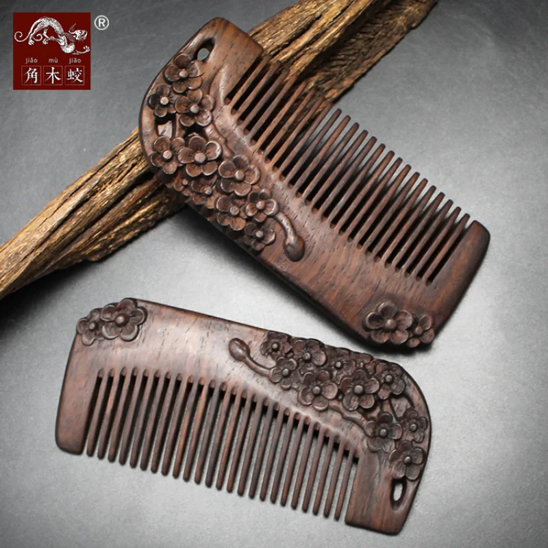 Solid wood carved plum blossom comb made from hornwood, ebony, and black sandalwood