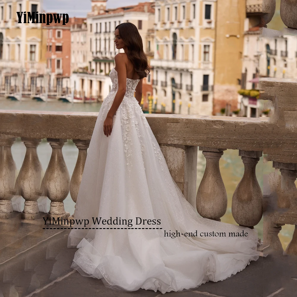 Błyszcząca suknia ślubna bez ramiączek, koronkowe aplikacje, linia A, suknie ślubne z odkrytymi ramionami, tren zamiatający, szyta na miarę 2025 Vestido De Noival