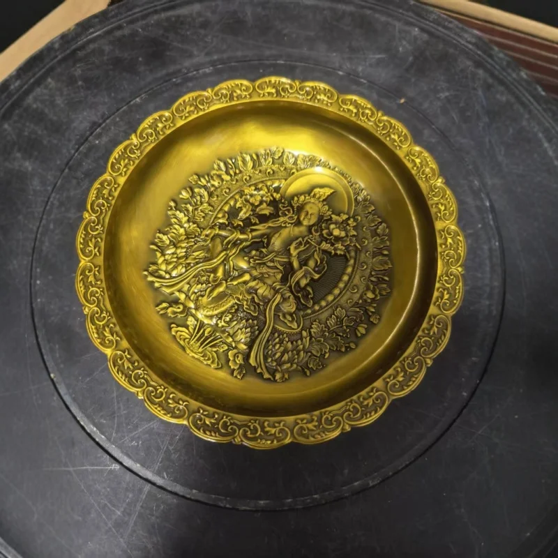 Embossed bronze Guanyin plate made in the Qianlong era, a decorative antique item, featuring a dragon and phoenix motif