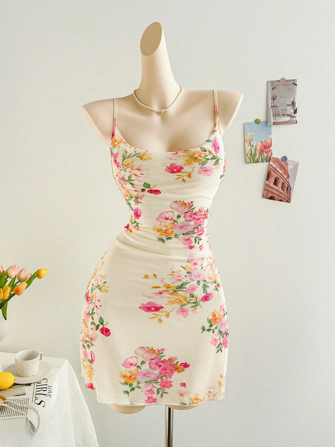 A stylish and elegant figure-hugging dress with a mesh floral print halter