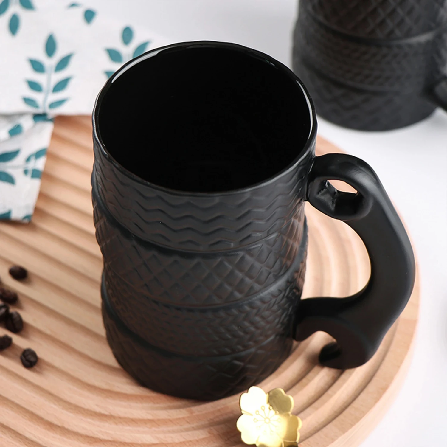 Enhance your morning routine with this comfortable and unique men's tire coffee mug. This quirky novelty ceramic cup with handle