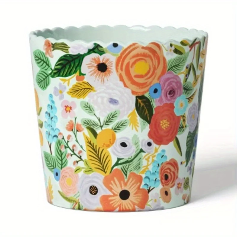

Indoor planter with scalloped top and colorful floral design