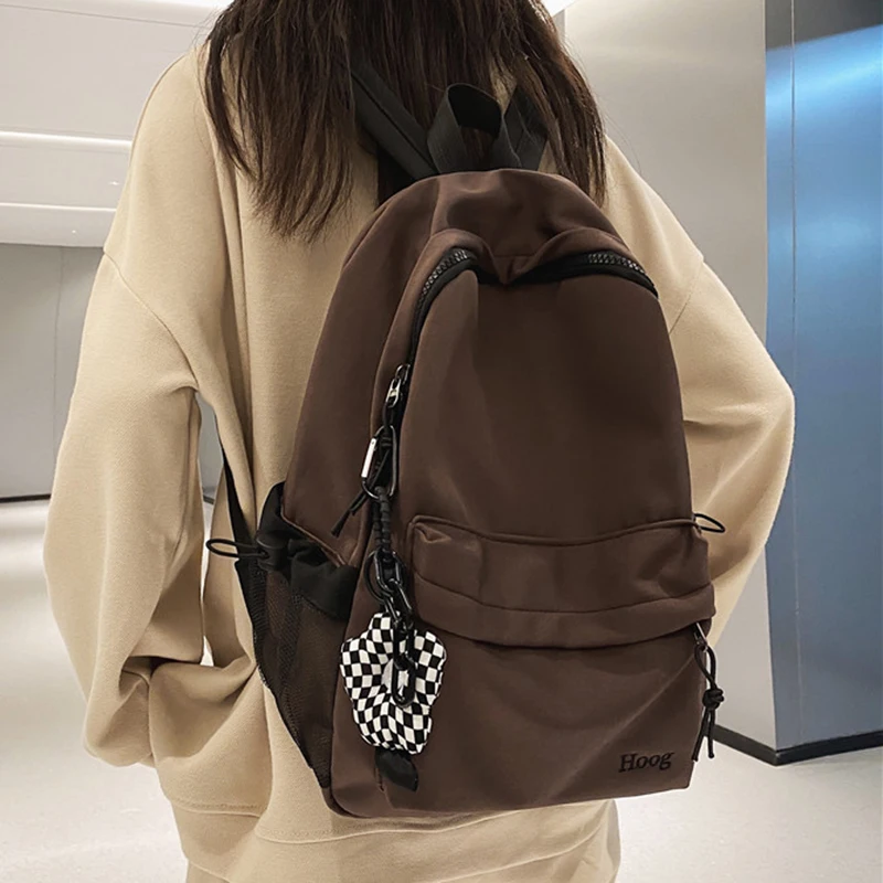 

Schoolbag female junior high school students large capacity simple design sense high school backpack college students backpack