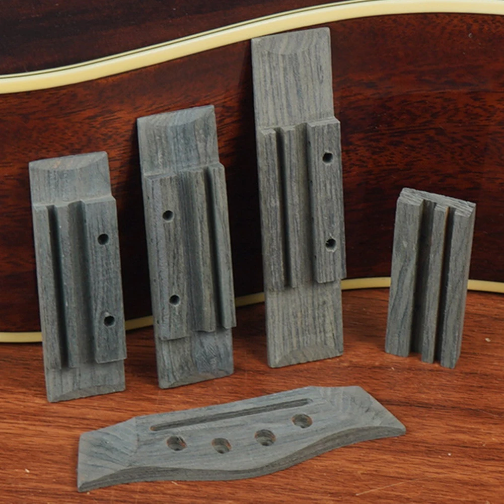 

Аксессуары для укулеле: Бридж для укулеле из палисандра, обеспечивающий оптимальное качество звука, с теплым и насыщенным тембром, материал — палисандр, для ремонта укулеле.