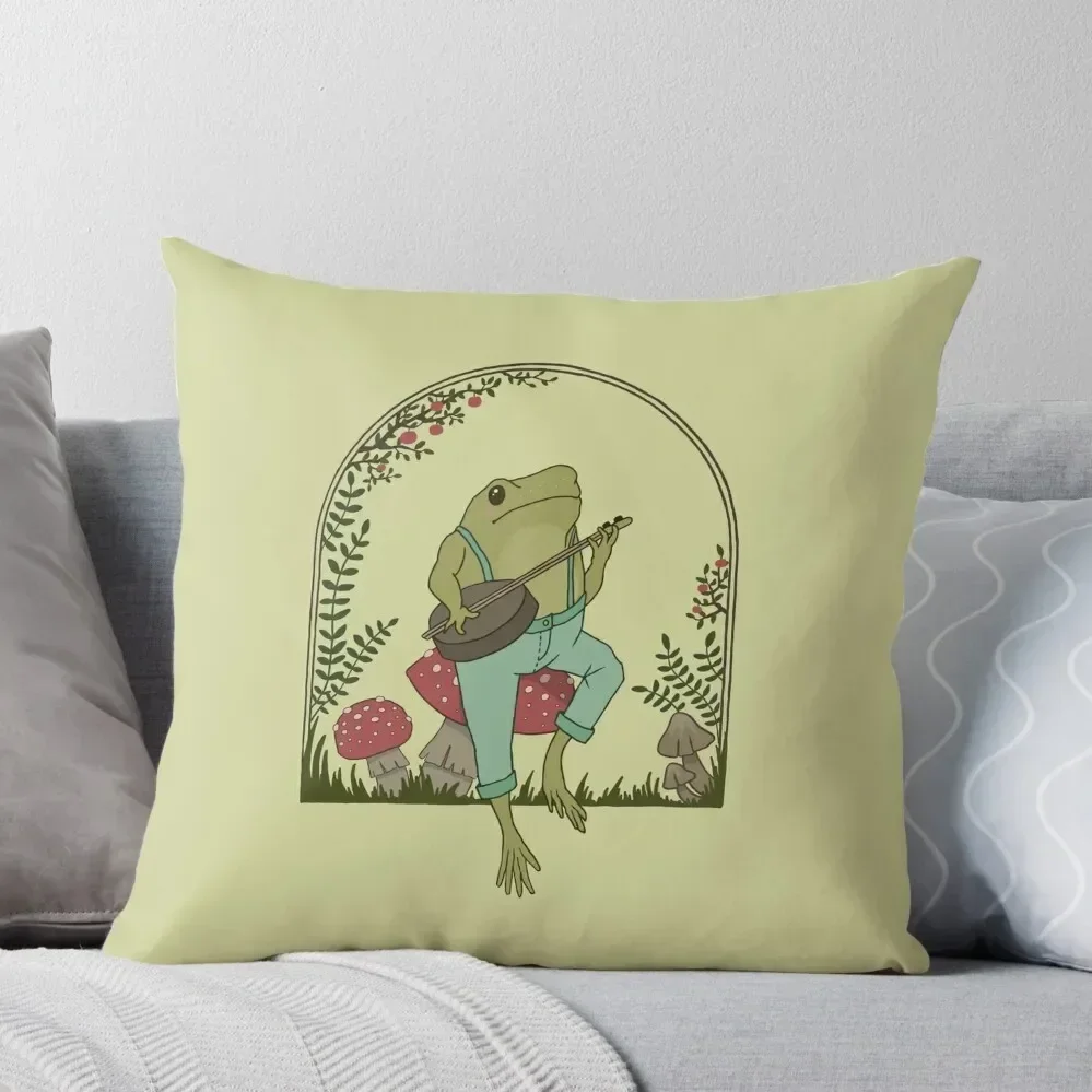 

Cottagecore Aesthetic Frog Playing Banjo on Mushroom: Cute Vintage Goblincore Farmer Toad in Garden, Emo Grunge Fai Throw Pillow