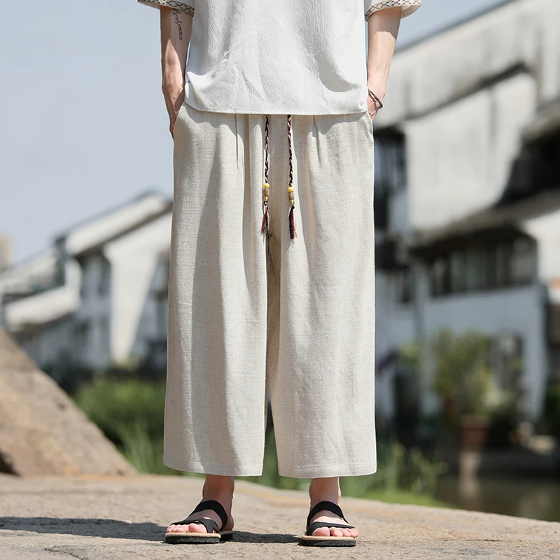Pantaloncini larghi da uomo Pantaloni casual traspiranti estivi Gamba larga in cotone di lino Taglie forti 5XL Pantaloni Harajuku comodi da esterno da uomo