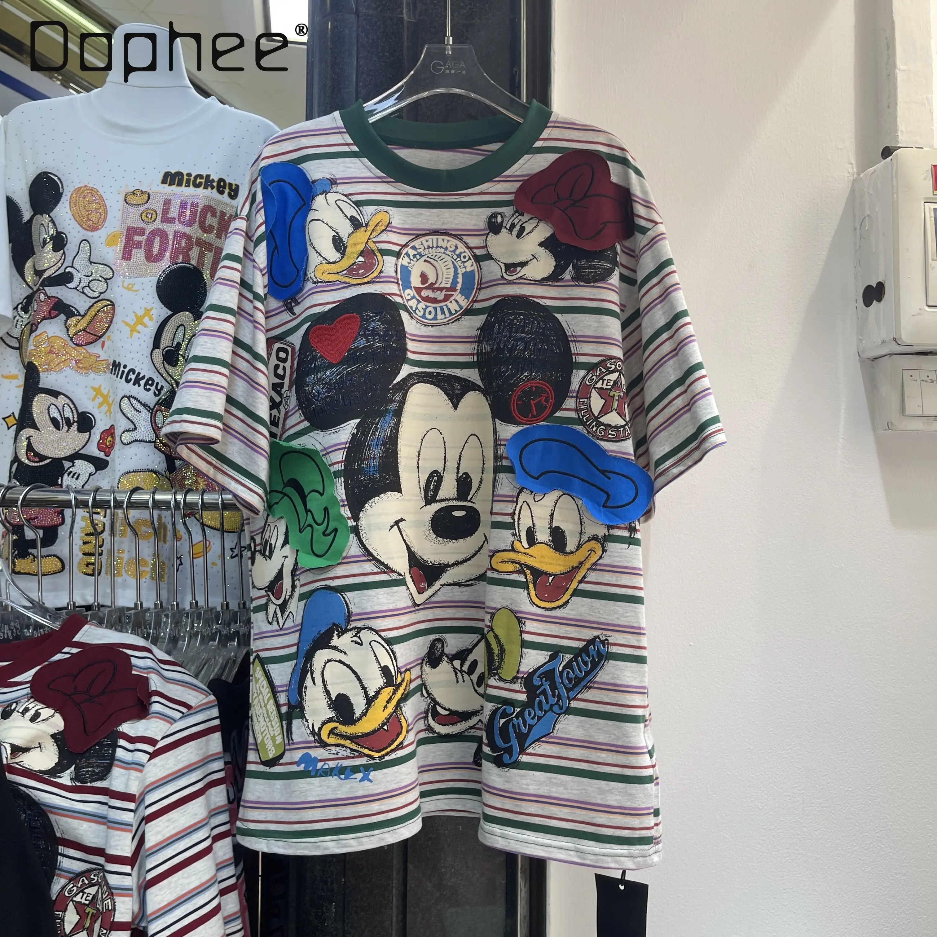 

Новая летняя женская футболка 2026 года в американском ретро-стиле с мультяшным узором утки, в полоску, с коротким рукавом, свободного кроя, средней длины, с принтом, повседневный топ