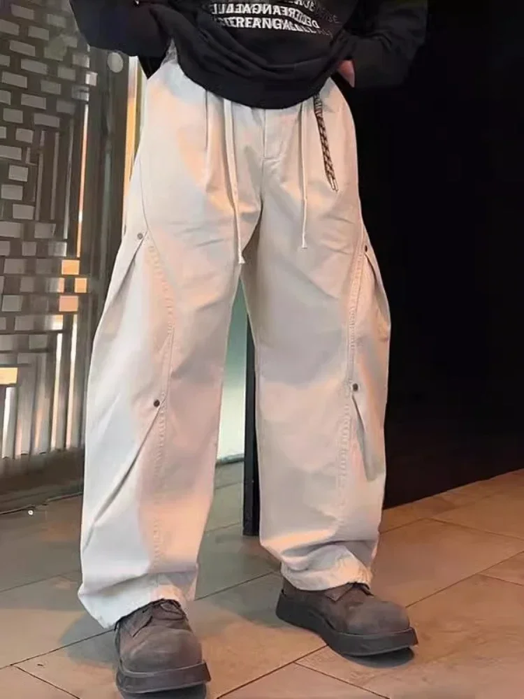 

Модельер Брюки с заклепками для мужчин Пирамида с заклепками Минималистичная уличная одежда Y2K Черные модные мешковатые брюки High Street