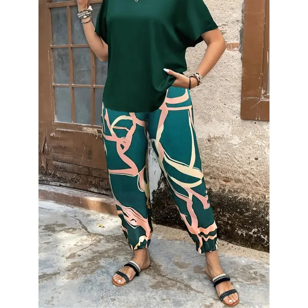 Grote maten damestop en contrasterende broek met print, tweedelige set, effen kleur top met korte mouwen en broek met wijde pijpen voor dagelijks gebruik