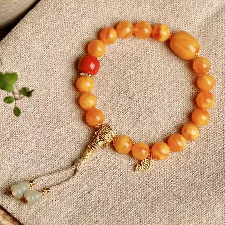 

Браслет из круглых бусин из натурального старого цветка с пчелиным воском, подвеска в виде рыбы из красного агата, серебряная футболка и нефритовая тыква Хэтянь