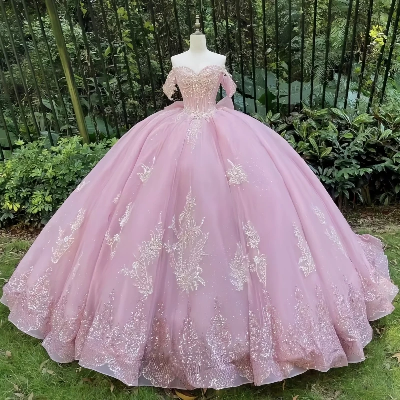 

Pink Shiny Quinceanera Dresses Ball Gown Off The Shoulder Applique Lace Bow Beading Crystal Tull Corset Sweet 16 Dress Vestidos