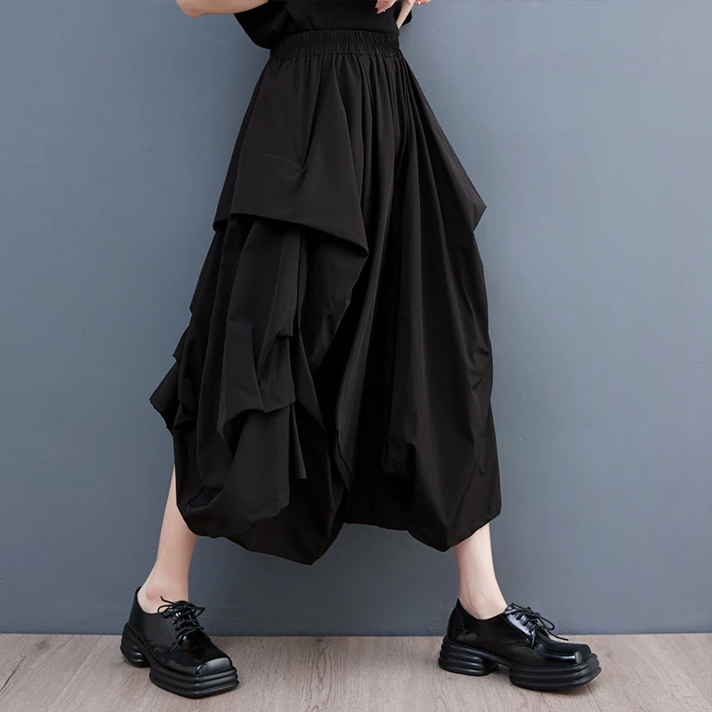 Szerokie spodnie z szerokimi nogawkami, elastyczna talia, plisowana spódnica codzienna, modna, uniwersalna, dobra jakość, możliwość warstwowego noszenia, styl do pracy.